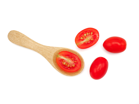 Fresh grape or cherry tomato with wooden spoon on white background.の写真素材