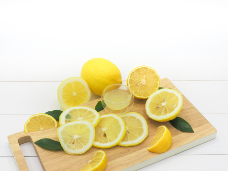 Fresh lemon slice with lemonade on white wood backgroundの写真素材