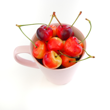 Sweet and healthy Rainier cherries on white background, fresh fruitsの写真素材