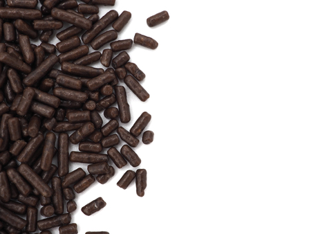 Chocolate sprinkles on white background, closeup view.の写真素材