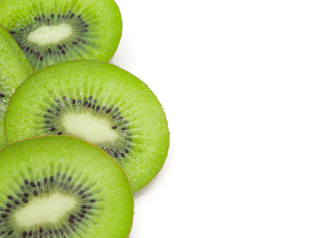 Slice of fresh juicy delicious and healthy kiwi fruit, isolated on white background.の写真素材