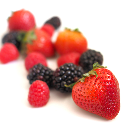 Fresh strawberry, raspberry and blackberry on wooden background, healthy food and diet.の写真素材