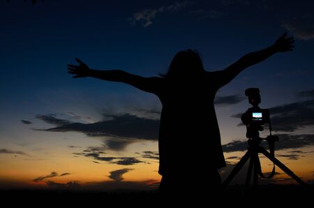 happy feeling man in silhouetteの写真素材