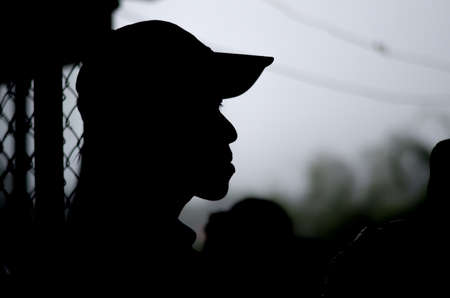 a man wear cap in silhouette backgroundの写真素材