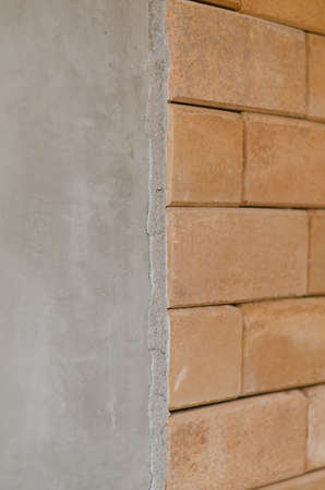 difference of concrete wall and red brick wallの写真素材