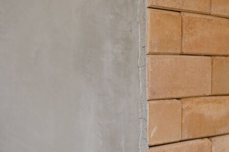 difference of concrete wall and red brick wallの写真素材
