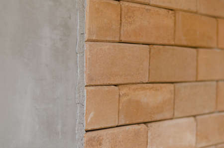 difference of concrete wall and red brick wallの写真素材