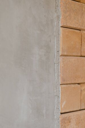 difference of concrete wall and red brick wallの写真素材