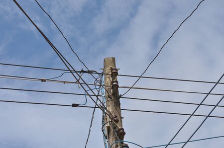 electric pole with blue skyの写真素材