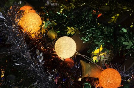 colorful beauty cotton light lamp on christmas tree and happy new year celebrationの写真素材