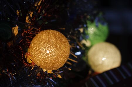 colorful beauty cotton light lamp on christmas tree and happy new year celebration,soft focusの写真素材