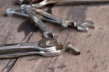 wrench  with nuts and bolt on the deskの写真素材