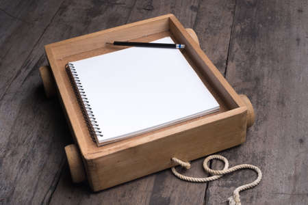 toy cart with notebookの写真素材