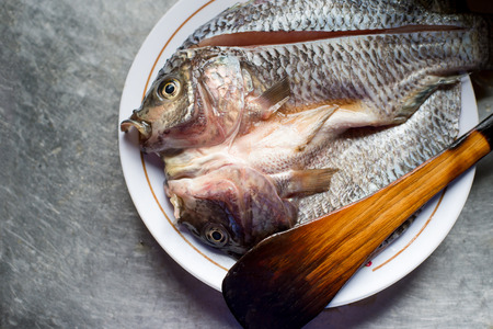 Tilapia fish ready to cook on the dish