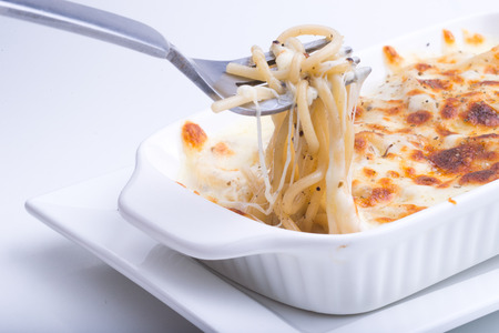 Spaghetti with baked chees and Spinachの写真素材