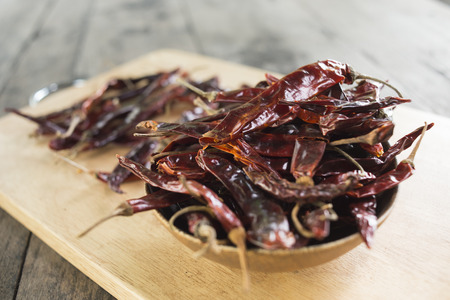 Dry Chili on wood tableの写真素材