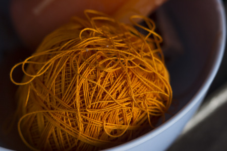 selective focus on thread spool low lightの写真素材