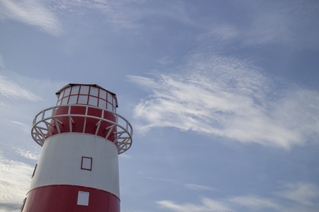 red and white light houseの写真素材