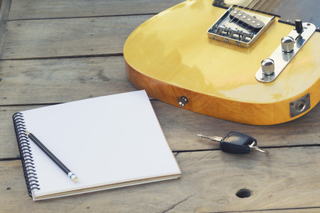 Telecaster with notepad on wood tableの写真素材