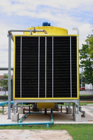Yellow cooling tower in plantの写真素材