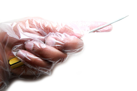 Gloves holding a screwdriver の写真素材