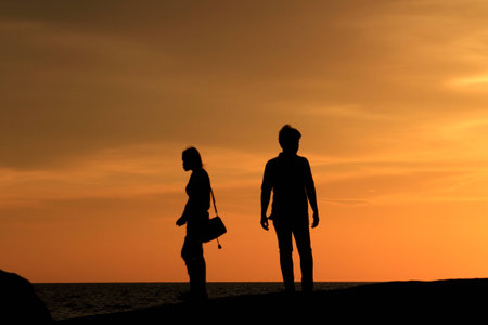 Silhouette of people in the evening at the beach.