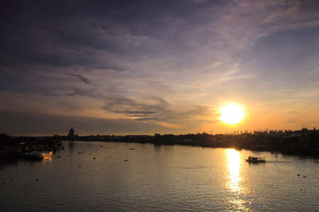 Silhouette photo, sunrise and boat on the sea