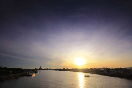 Silhouette photo, sunrise and boat on the sea