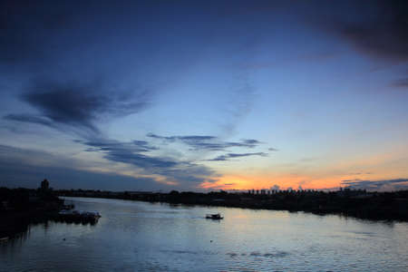 Morning sunrise and boat on the river