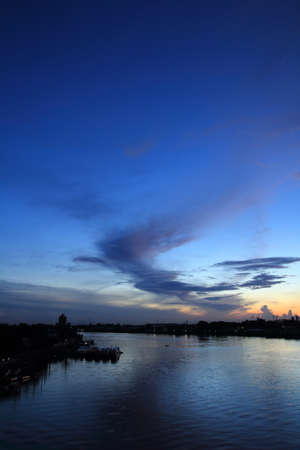 Morning sunrise and boat on the riverの写真素材