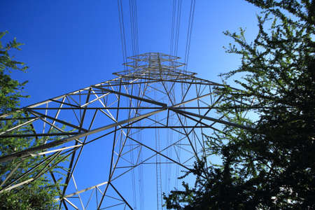 High voltage poles on the side of the road