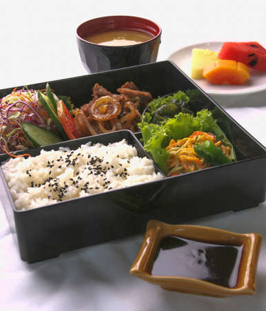 Japanese bento set served with soup and fruitの写真素材