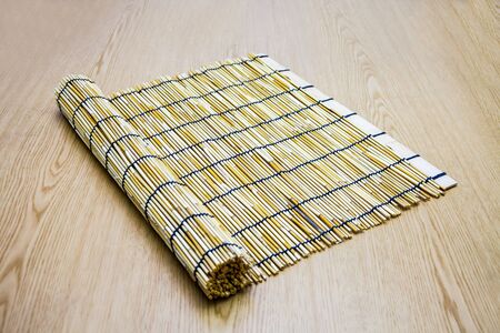 Reed rolls on wood backgroundの写真素材