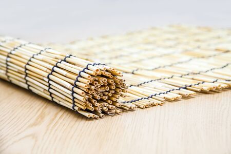 Reed rolls on wood backgroundの写真素材