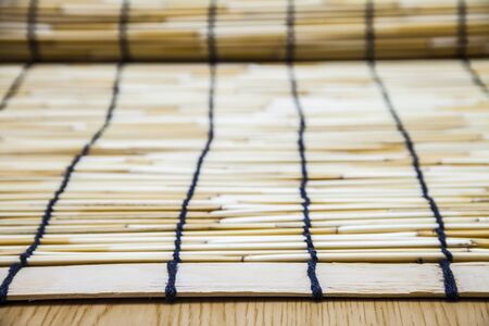 Reed rolls on wood backgroundの写真素材