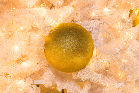Gold ball on christmas treeの写真素材