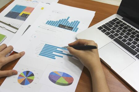 young business man and Partner are proposing business plans to young entrepreneurs to enhance long-term trading performance.の写真素材