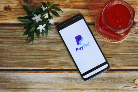 CHIANG MAI, THAILAND - August 11 ,2020 : Paypal logo on smartphone screen. Paypal is an American online payment and banking company.のeditorial素材