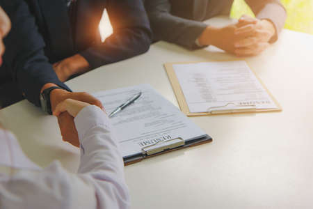 Business handshake. businessman reaching an agreement and making a deal.の写真素材
