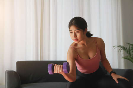 stress relief, muscle relaxation, breathing exercises, exercise, meditation, woman exercising after finishing work in the office.の写真素材