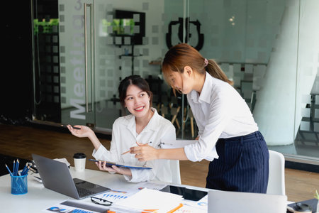 Marketing, Financial, Accounting, Planning, Team of female businessmen and economists use calculators and computers and graph documents to profit the company.の写真素材