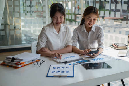 Marketing, Financial, Accounting, Planning, Businesswoman expressing joy that the company has profited from her team work.の写真素材