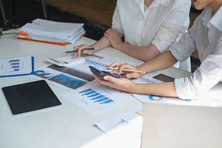 Marketing, Financial, Accounting, Planning, Casual meeting of smiling diverse business team analyzing financial data, Planning Concept.の写真素材
