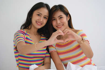 lgbtq, lgbt concept, homosexuality, two beautiful women showing their love to each other in a very...