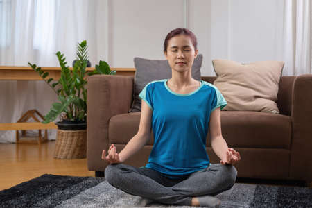 relax, de-stress, holiday, happy, Asian woman relaxing at home listening to music from smartphone...