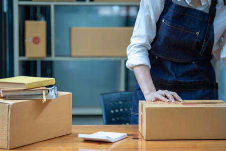 Online sales woman business owner Receive orders and deliver products with boxes to customers....