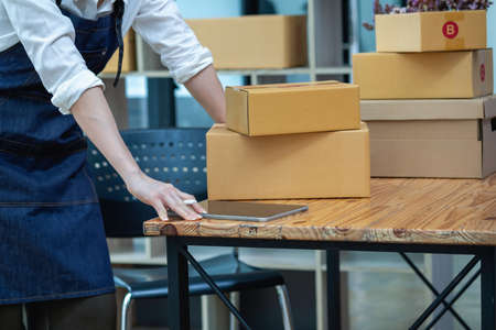 Online sales woman business owner Receive orders and deliver products with boxes to customers....