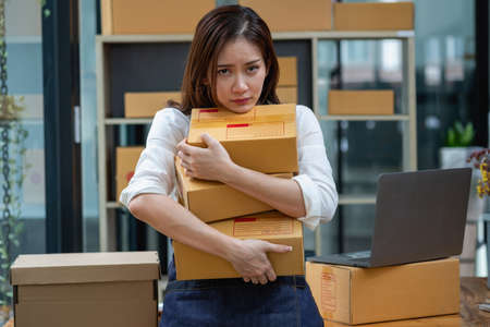 Asian businesswoman worried about unordered online sales