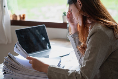 Marketing, Financial, Accounting, Planning, business women analyze company results and profits with graph statistics. Use a laptop computer and a calculator to calculate the company's balance.の写真素材