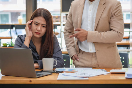 The female worker was fed up with being told by her employer that she had no time for breaks and paperwork to be placed on her desk.の写真素材